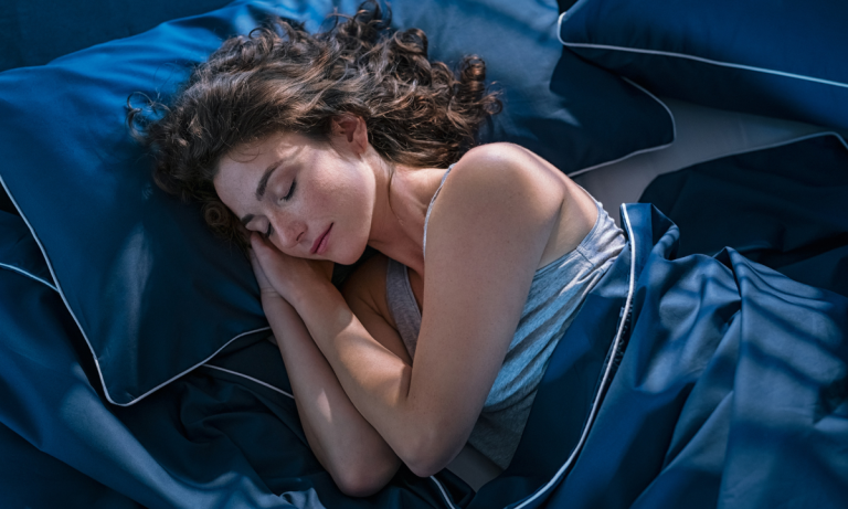 young woman sleeping soundly - featured image